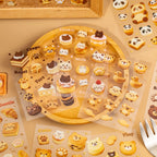 Transparent bakery-themed sticker sheets from the Baking Story Journaling Sticker Set displayed with animal pastries and dessert designs