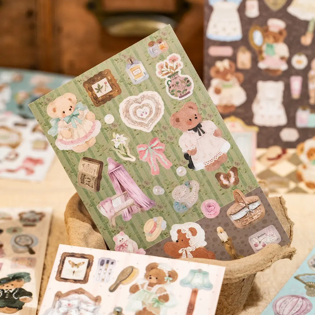 Bear Diary green vintage sticker sheet displayed in a tray with bear characters, bows, flowers, frames, and soft home decor details