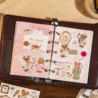 Bear Diary stickers used in a ring binder journal spread with bears, cake, lace, buttons, and vintage paper accents