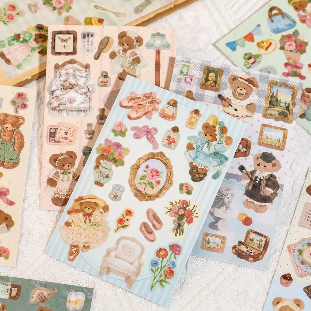 Bear Diary sticker sheets laid flat with illustrated bears, dresses, picture frames, flowers, furniture, and vintage decorative elements