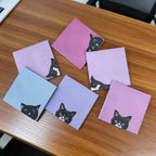 Black Cat sticky notes in use as page markers, planner reminders, and decorative journal notes.