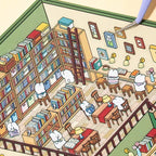 Placing wall decor stickers onto the Bookshop scene card with tweezers