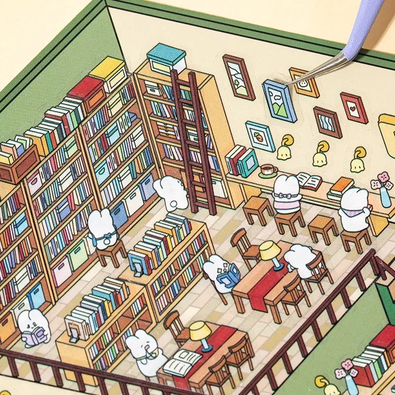 Placing wall decor stickers onto the Bookshop scene card with tweezers