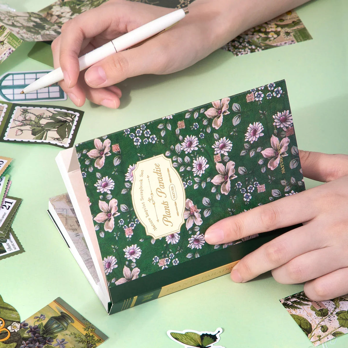 Botanical Haven Junk Journal Kit gallery image 3 showing botanical papers, leafy stickers, and nature-inspired ephemera for junk journaling and scrapbooking