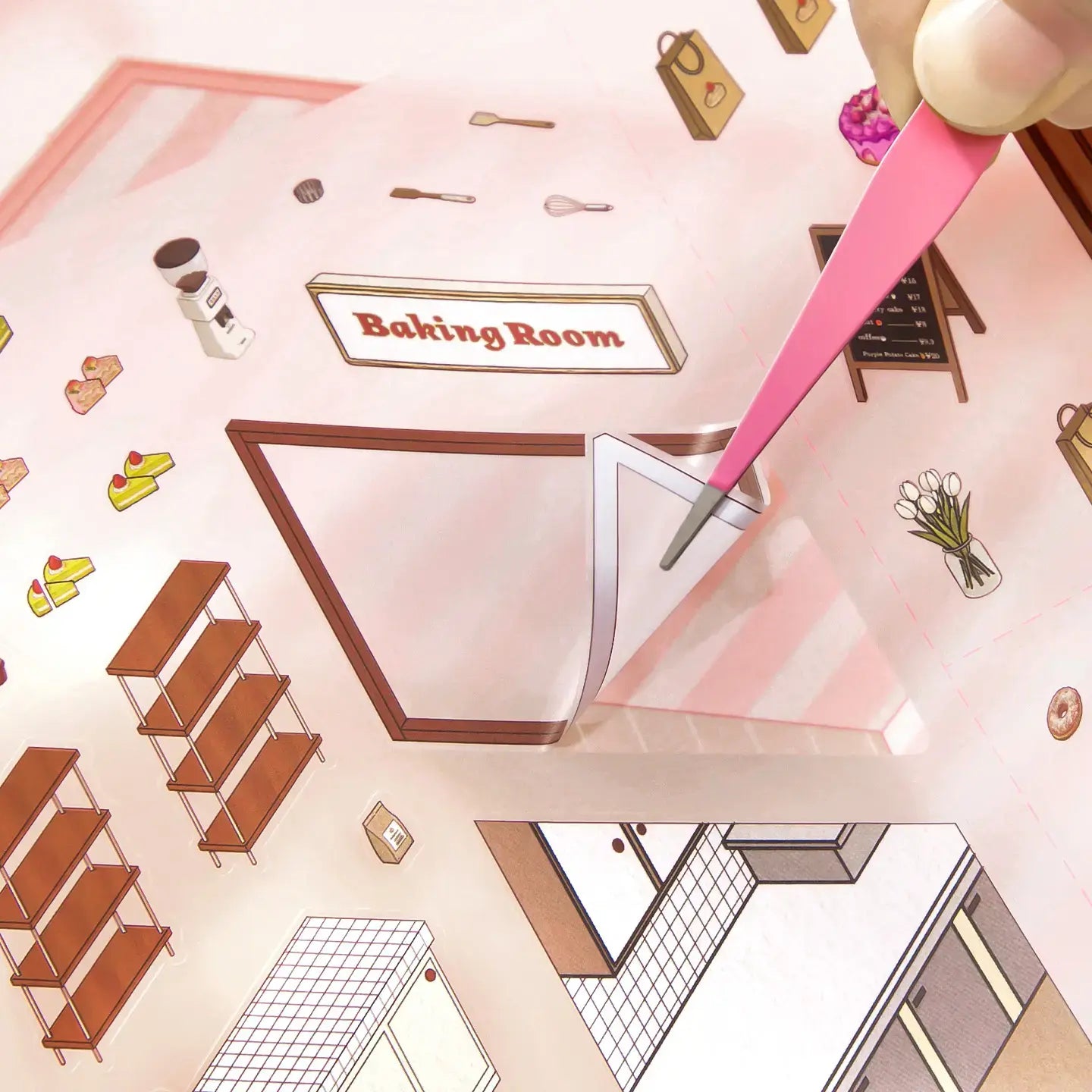 Tweezers placing a frosted PET sticker onto the Cake Story miniature cake shop scene card