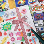 Close-up of Candy Dance retro candy stickers with a gingham bow, gummy bears, buttons, and colorful icons