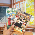 Cat Journey journaling sticker set with two Japanese-style cat sticker books displayed in a classroom scene