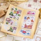 Open journal decorated with Color Border stickers, floral stickers, photo-style frames, and soft collage layouts