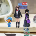 Close-up of character-style stickers from the Colorful Daily Life Journaling Sticker Book arranged on a desk
