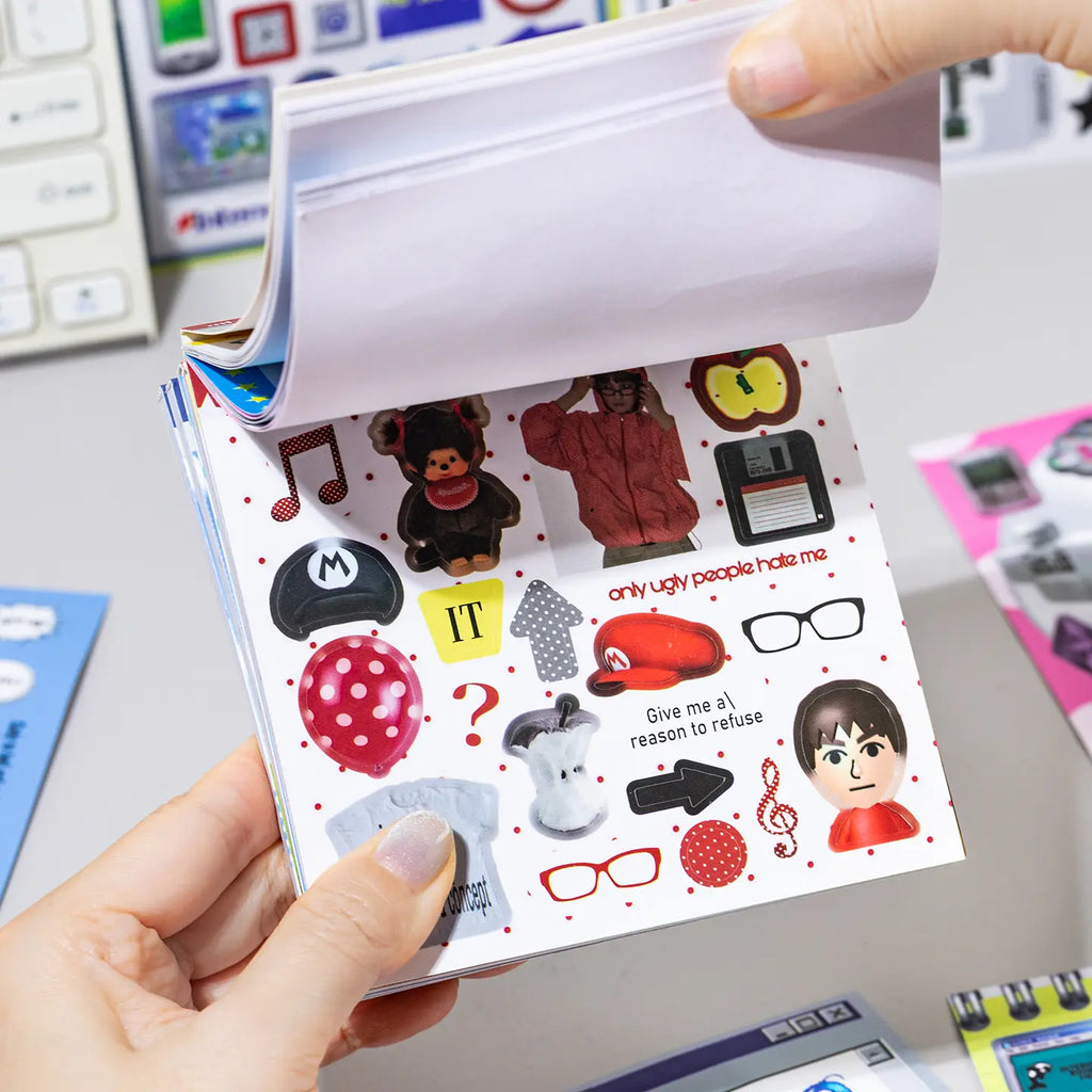 Side view of the Colorful Daily Life Journaling Sticker Book showing multiple coated paper sticker pages