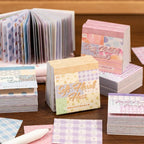 Cozy Childhood Dreams sticky notes assortment showing four soft grid note designs for creative planning.