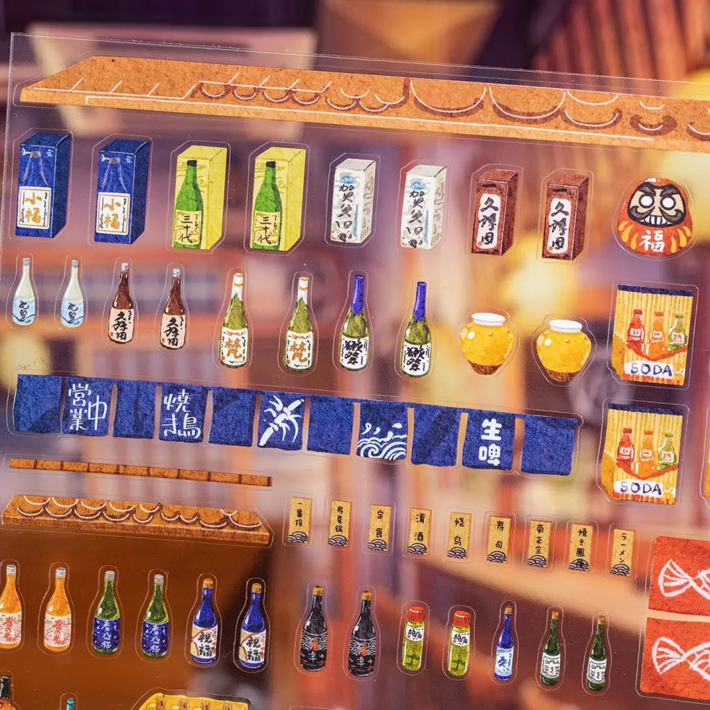 Close-up of Cozy Izakaya gloss PET sticker sheet with bottles, signs, curtains, and small restaurant elements