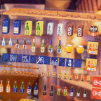 Close-up of Cozy Izakaya gloss PET sticker sheet with bottles, signs, curtains, and small restaurant elements