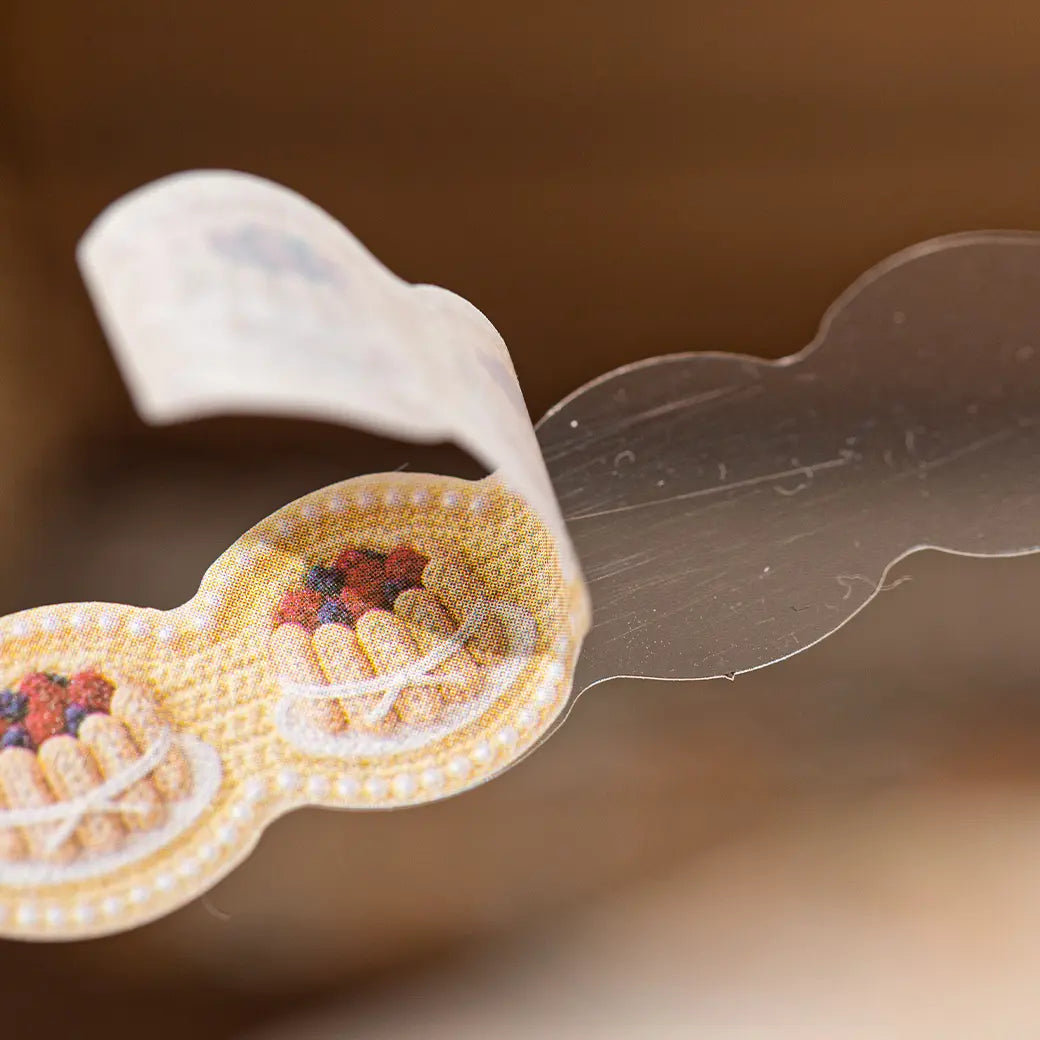 Close-up of a crochet-look journaling sticker showing washi paper texture and peeling detail