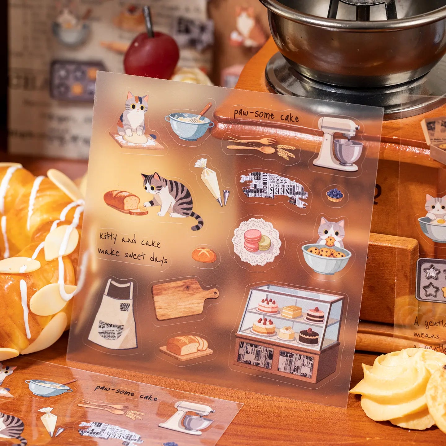 Close-up of a Daily Serenity cat sticker sheet with bakery, dessert, and kitchen elements