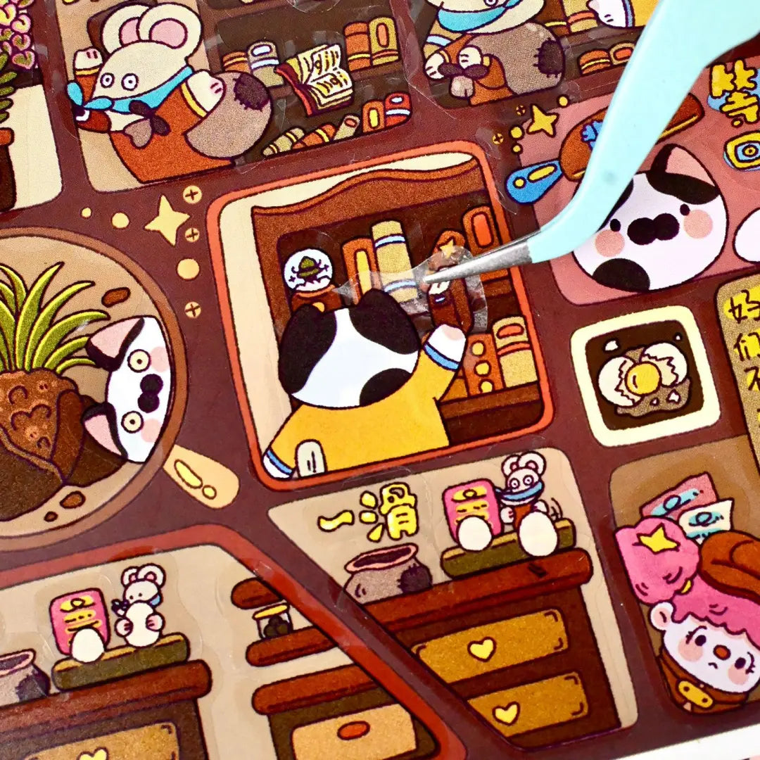 Close-up of a cat sticker being placed onto the Detective Mini Theater background scene