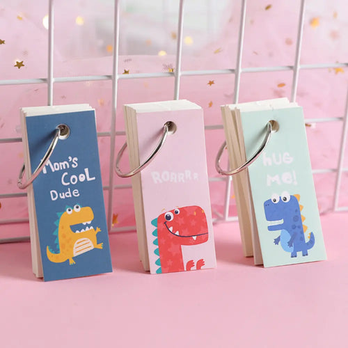 Dinosaur Ring memo pad assortment showing cute dinosaur note pages with ring-bound portable format.