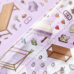 Close-up of glossy PET stickers for the Dreamy Craft Shop scene kit, showing a lampshade, yarn, sewing machine, and craft table pieces
