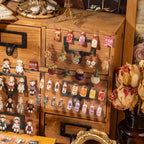 Completed dried flower and doll shop scenes created with miniature transparent stickers