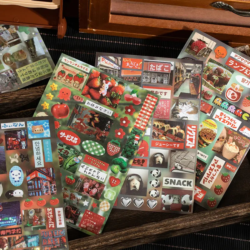 Assorted sticker sheets from the Echoes of Memory Journaling Sticker Book with fruit, shop signs, labels, and retro collage details