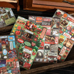 Assorted sticker sheets from the Echoes of Memory Journaling Sticker Book with fruit, shop signs, labels, and retro collage details