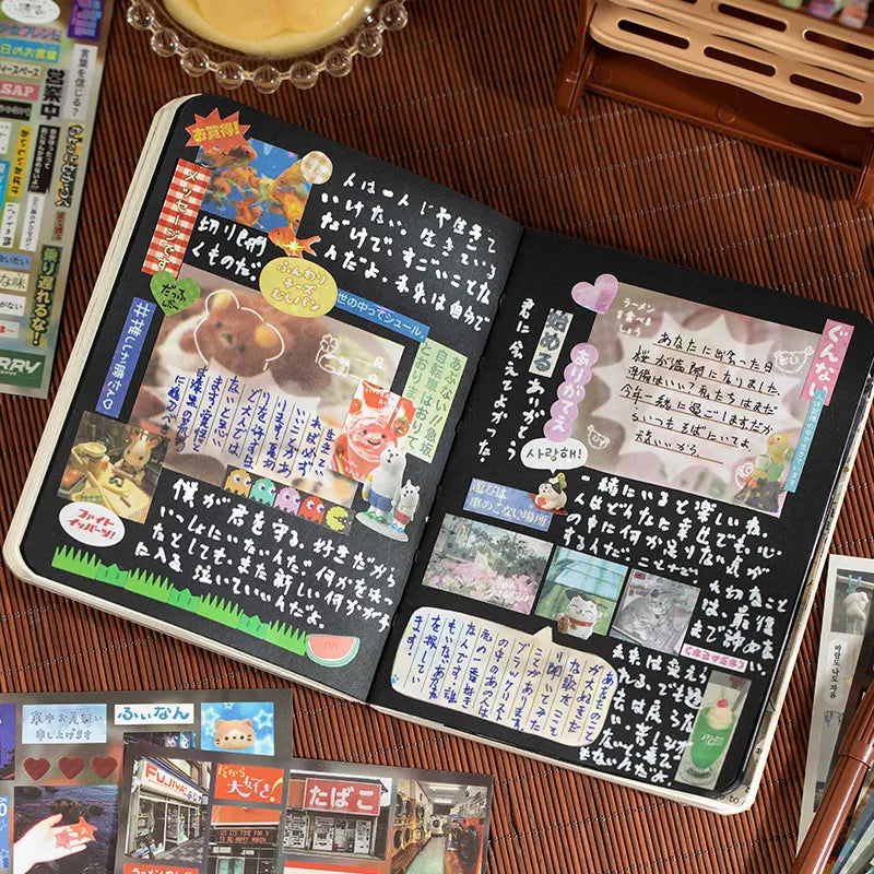 Black journal spread decorated with layered stickers and handwritten notes from the Echoes of Memory Journaling Sticker Book