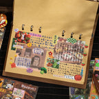 Kraft journal page decorated with stickers from the Echoes of Memory Journaling Sticker Book