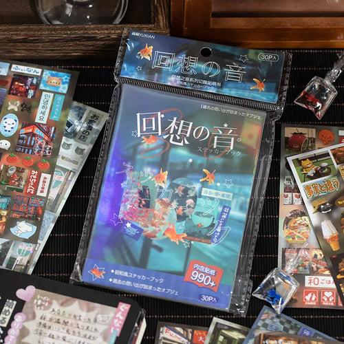 Echoes of Memory Journaling Sticker Book in its package with retro Japanese-inspired sticker sheets around it