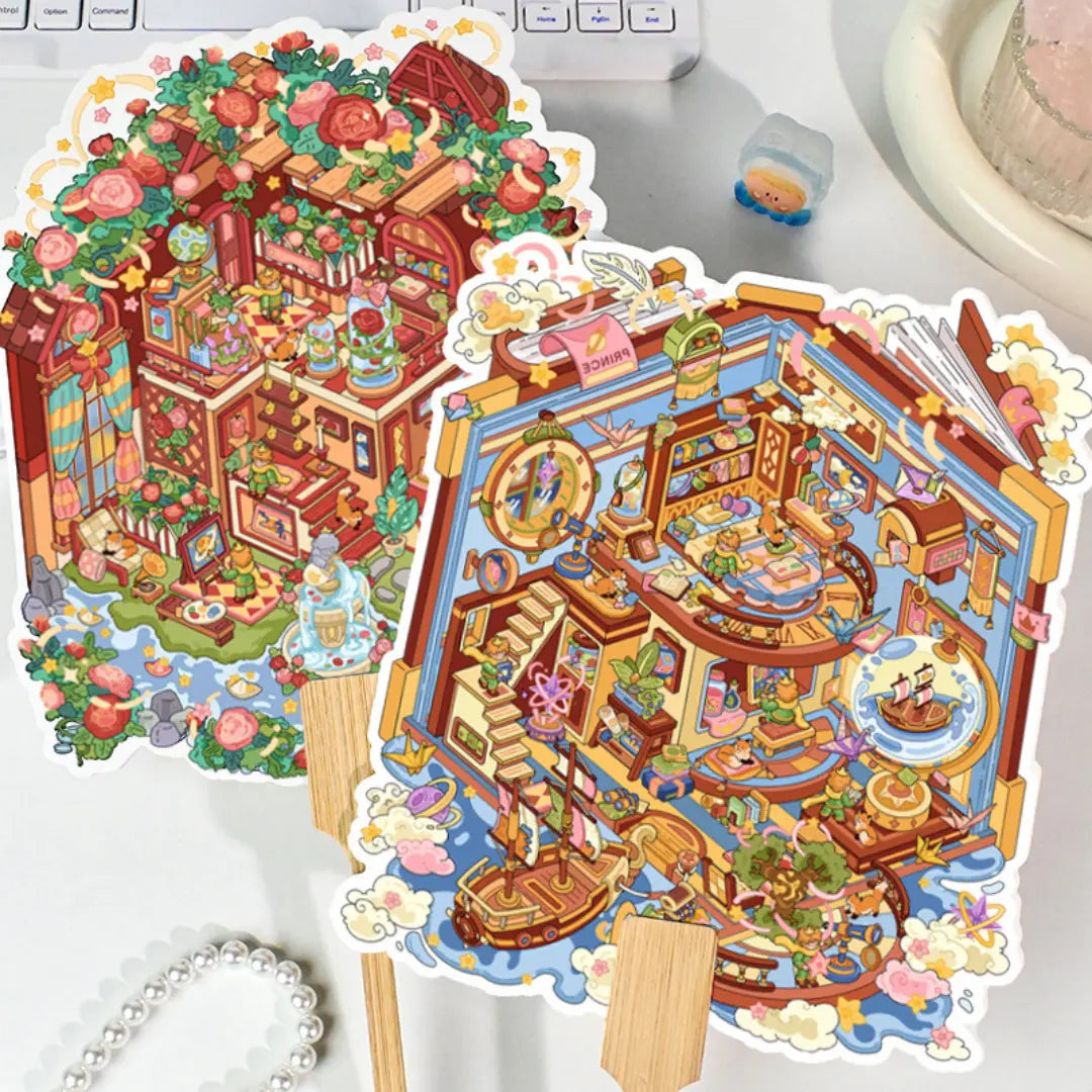 Two finished fantasy room 3D scene sticker kits with bamboo handles on a desk