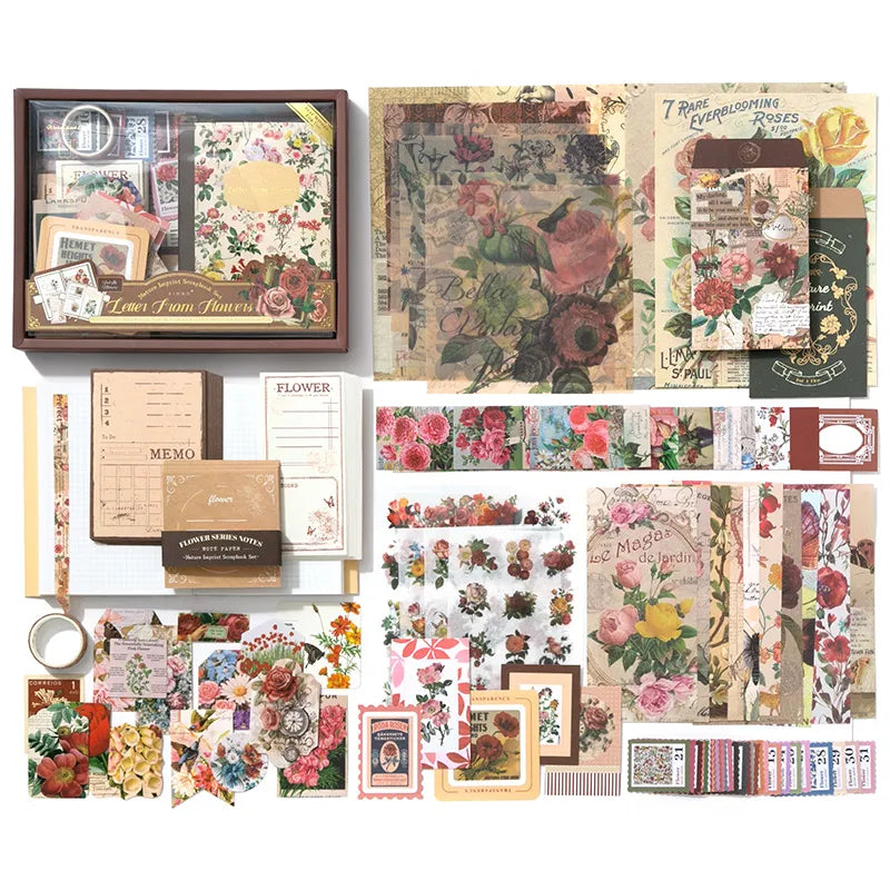 Floral Correspondence Junk Journal Kit flat lay showing the coordinated papers, ephemera, stickers, and craft embellishments included in the set