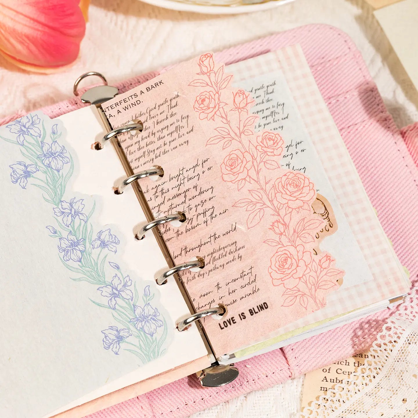 Floral journaling stickers used in a ring planner with layered paper and botanical page decoration