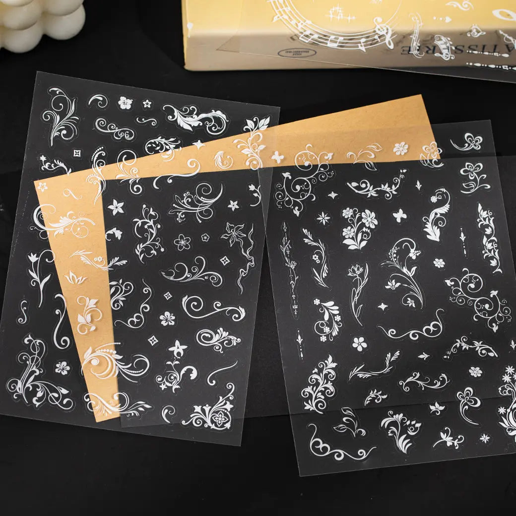 Clear PET sticker sheets with white floral ornaments and decorative line designs for journaling