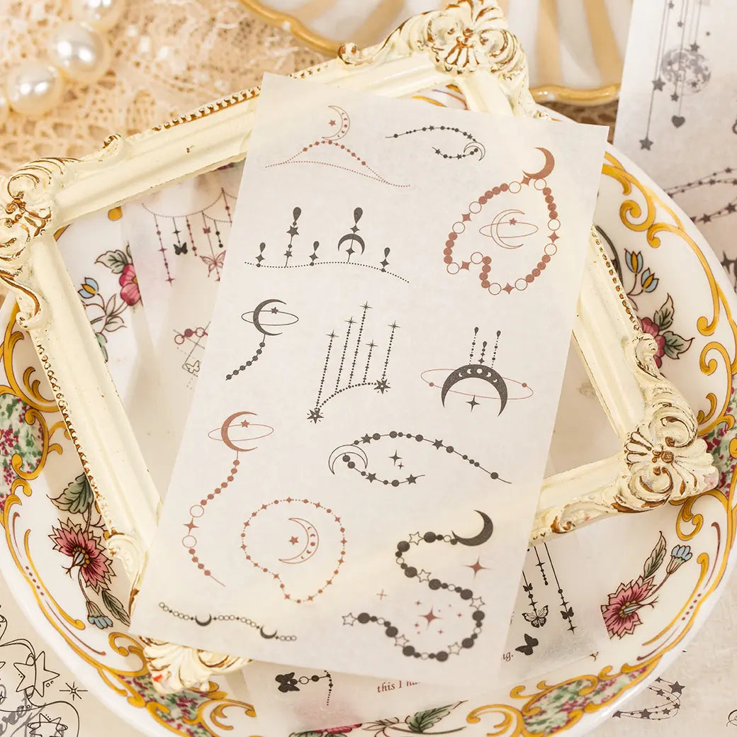 Full Moon sticker sheet featuring moons, planets, stars, and hanging celestial ornaments