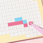 Placing small square stickers onto a numbered pixel mosaic grid from Gourmet Collection