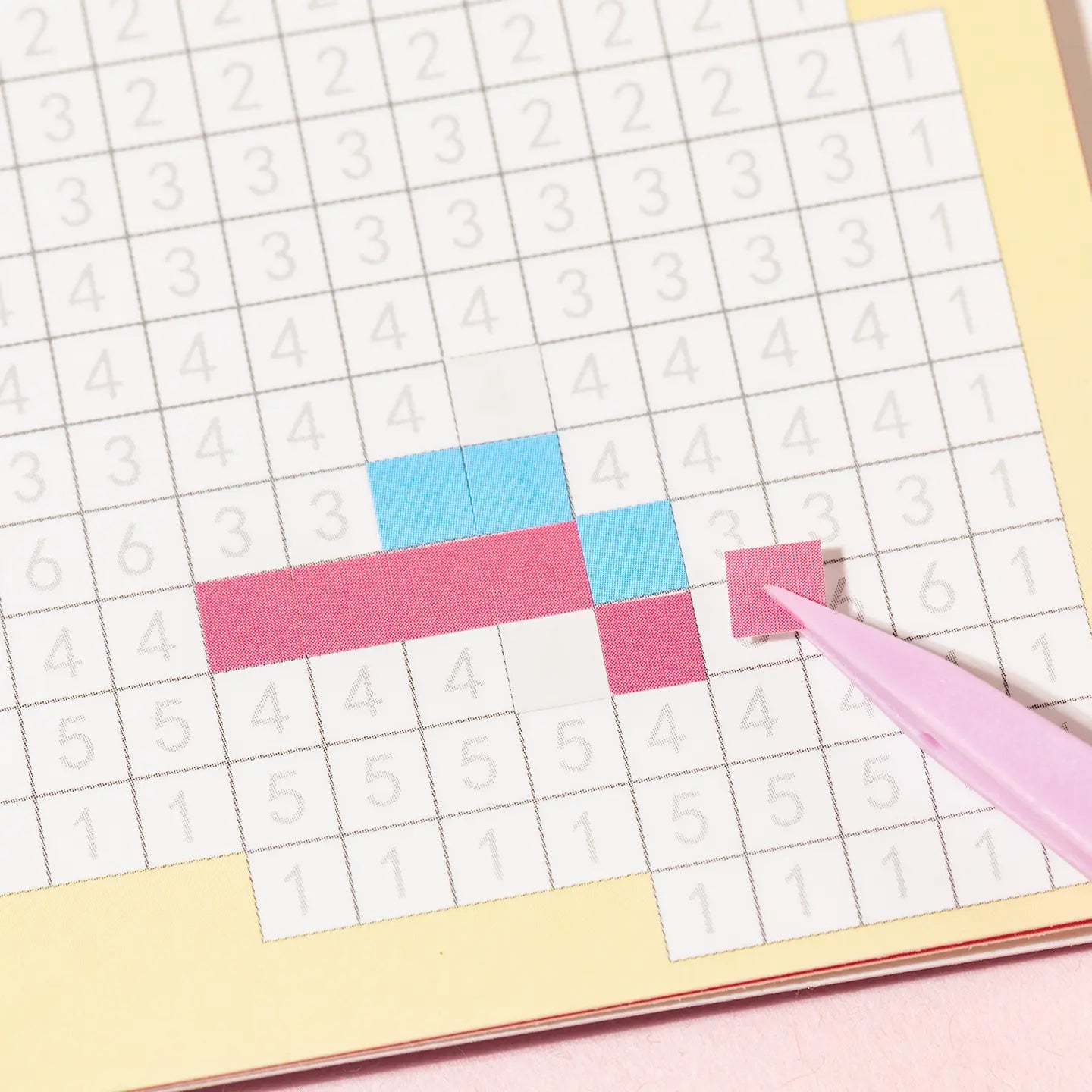 Placing small square stickers onto a numbered pixel mosaic grid from Gourmet Collection