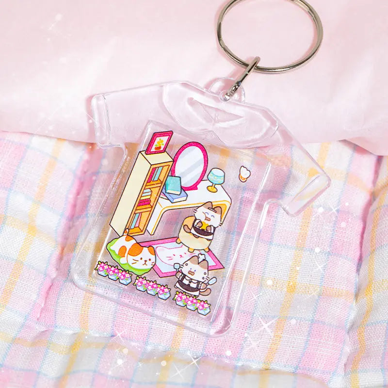 Grand Villa sticker pieces used to decorate a clear acrylic keychain charm
