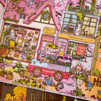 Close-up of the finished Gulu Town Seasonal Limited Edition miniature scene with flower cart, storefronts, and pastel houses