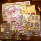 Gulu Town Seasonal Limited Edition scene backboard and PVC sticker sheets laid out on a wooden desk