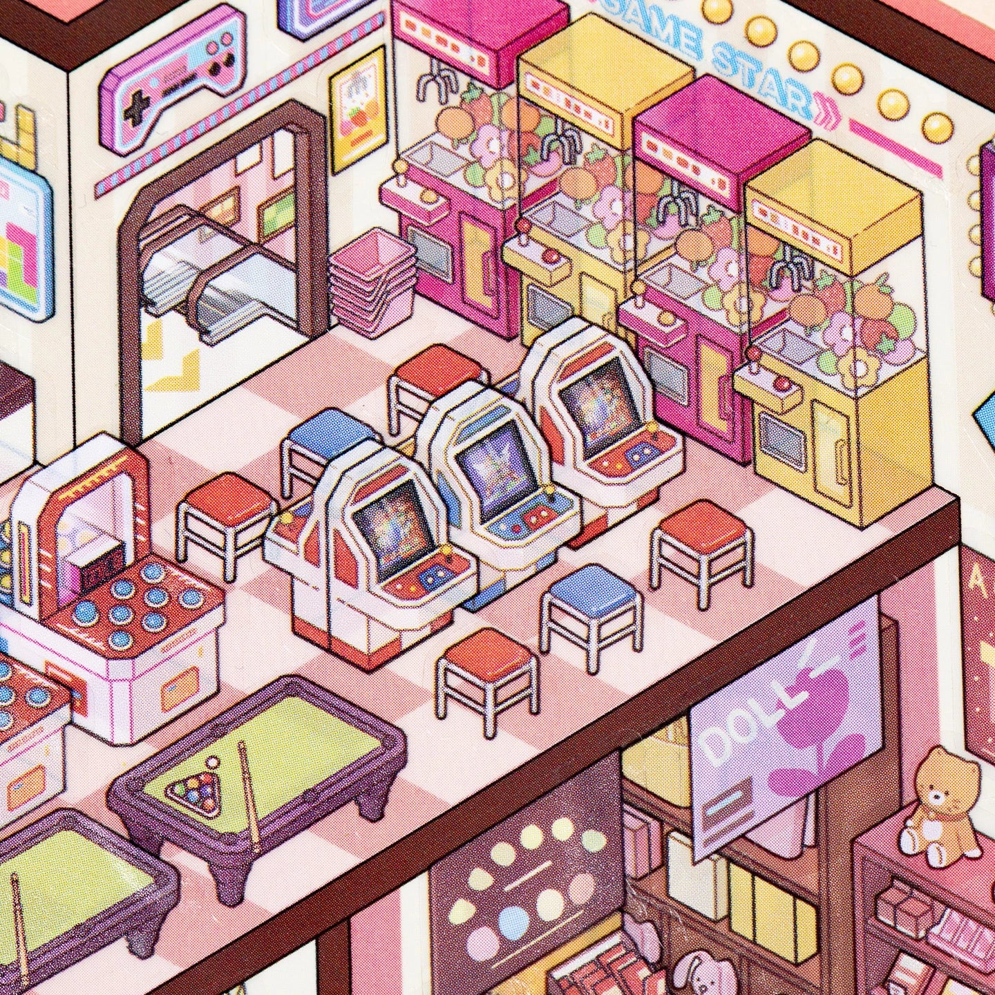 Close-up of arcade machines, claw machines, and game area details in the miniature mall scene