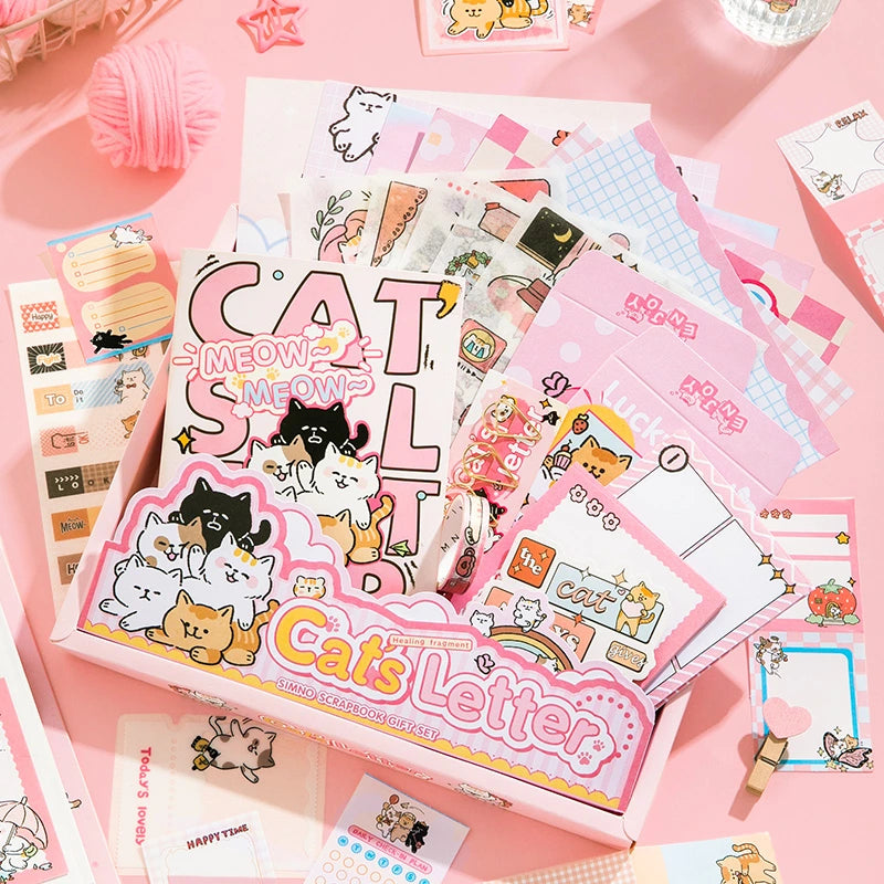 Kitten Mail Junk Journal Kit cat ephemera flat lay with pink papers, cards, stickers, and decorative pieces