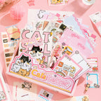 Kitten Mail Junk Journal Kit cat ephemera flat lay with pink papers, cards, stickers, and decorative pieces