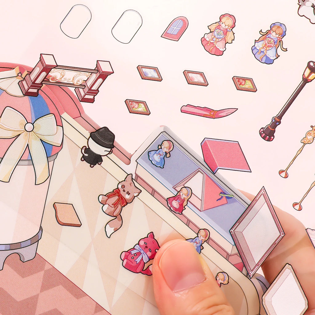 Close-up of small dollhouse stickers being placed on the Lolita Dollhouse scene background