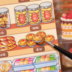Close-up of an egg tart PET sticker being placed on a bakery scene card
