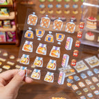 Die-cut PET sticker sheet with packaged bread, jars, pastries, and food display stickers