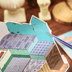Close-up of the Magic Old House background card with guide markings for sticker placement