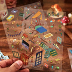 PVC sticker sheets for the Magic Old House 3D Scene Sticker Kit with furniture, stairs, plants, and room details