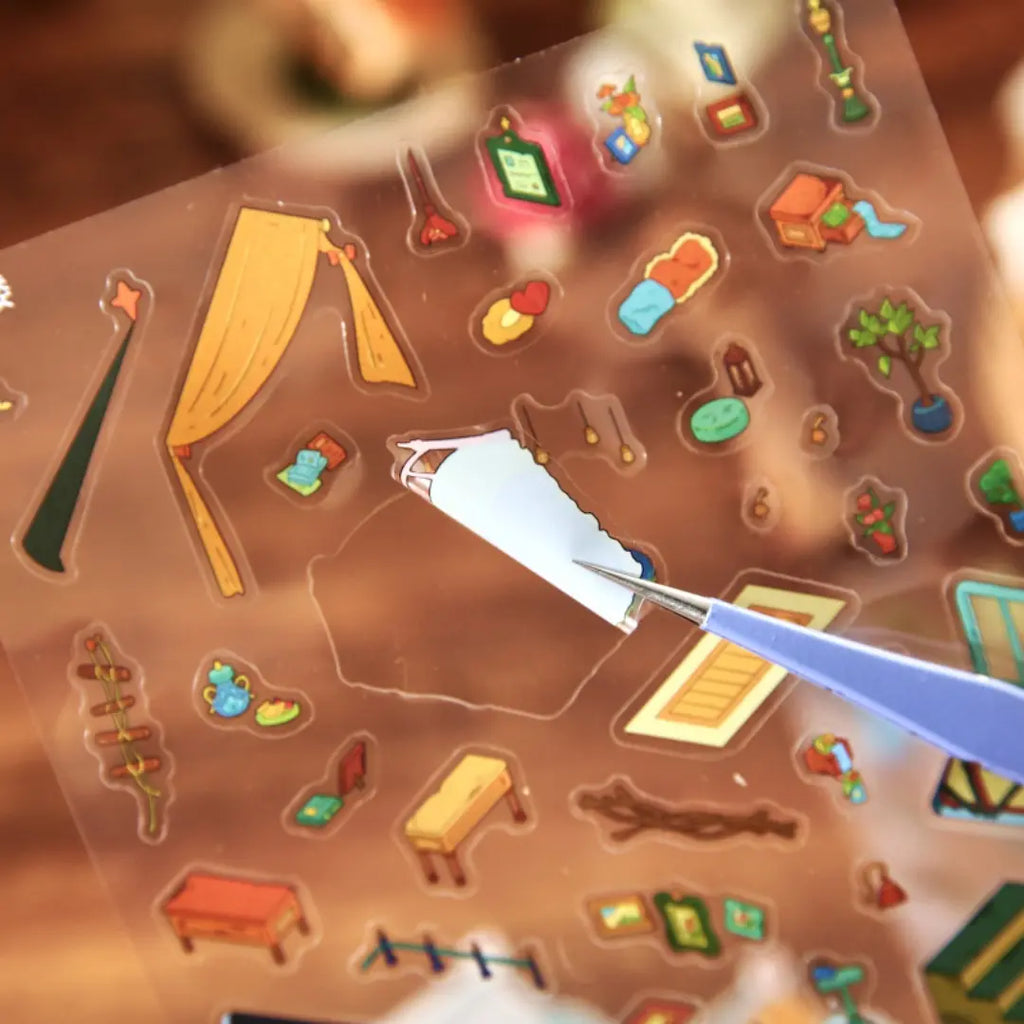 Close-up of a PVC sticker being peeled from the Magic Old House 3D Scene Sticker Kit sheet