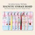 Magnetic tweezer storage board on a craft desk holding pastel tweezers for sticker and miniature DIY projects