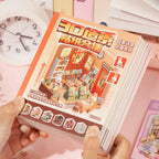 Mini Store Owner 3D Scene Sticker Book held in hand with bookstore cover and colorful scene pages