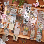 Nature's Whisper Junk Journal Kit gallery image 4 showing earthy botanical papers, stickers, and vintage-style ephemera for junk journaling and collage